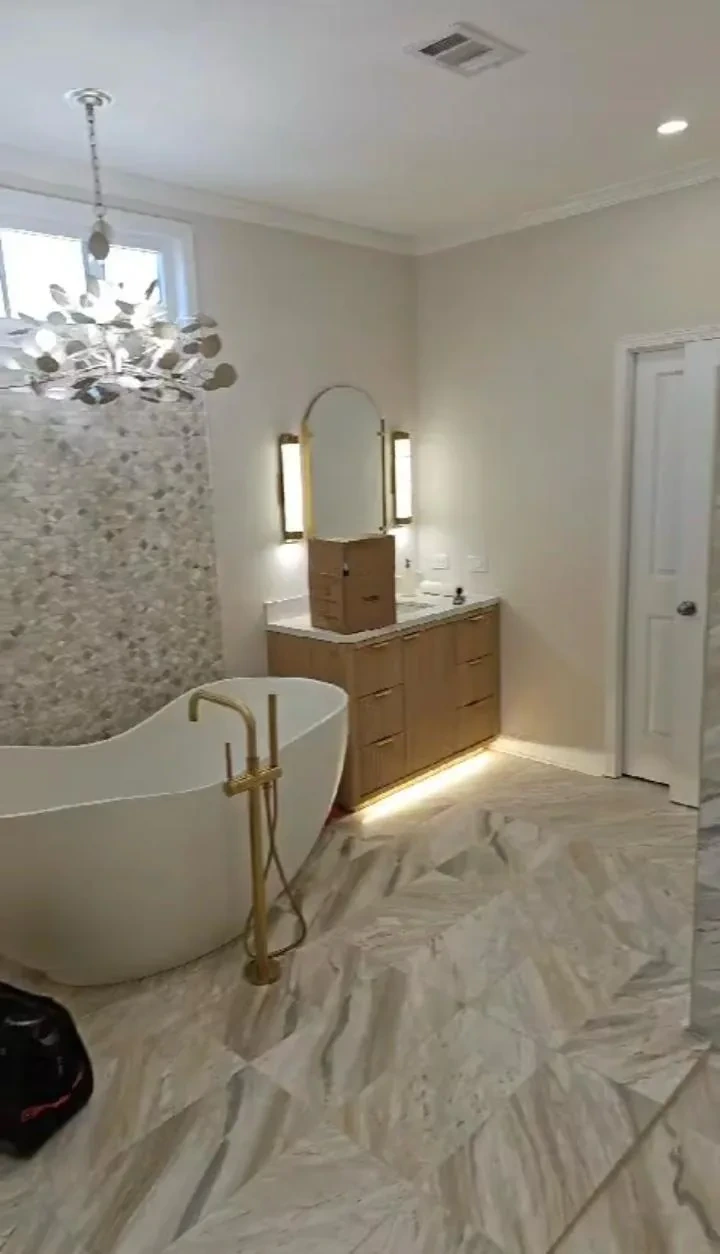 Complete luxury bathroom with freestanding tub, custom tile and modern fixtures