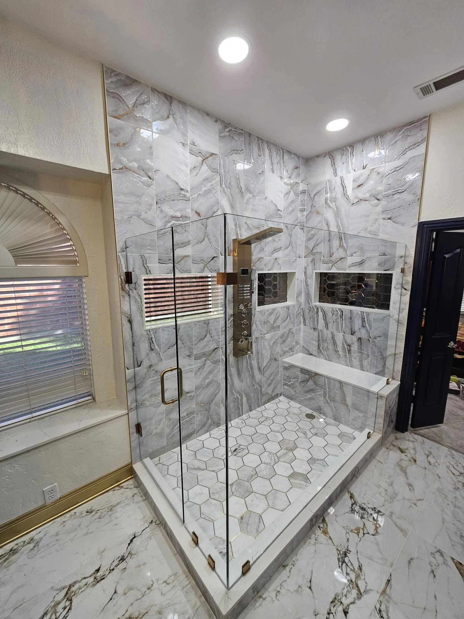 Marble shower and freestanding tub with brass fixtures — Pompano Beach, FL