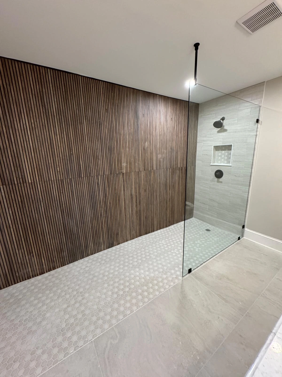 Open walk-in shower with ribbed wood-look tile and curbless entry — Boca Raton, FL