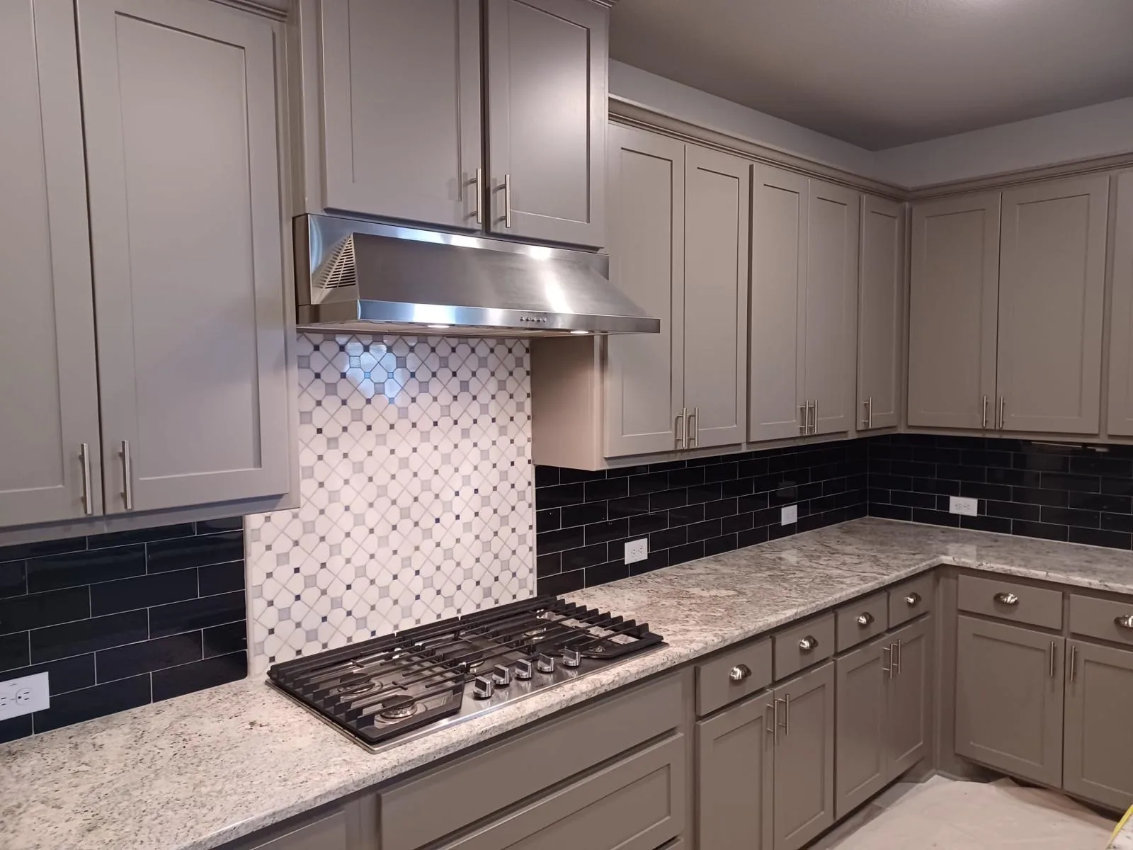 Custom walk-in shower with recessed niche and mosaic tile accent in bathroom remodel Deerfield Beach FL