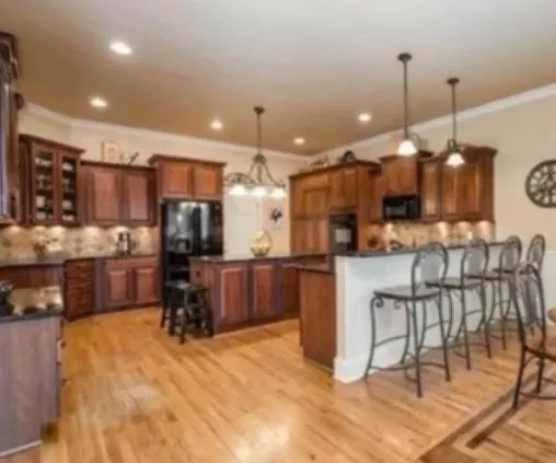 Kitchen before remodeling — outdated cabinets and countertops in South Florida home