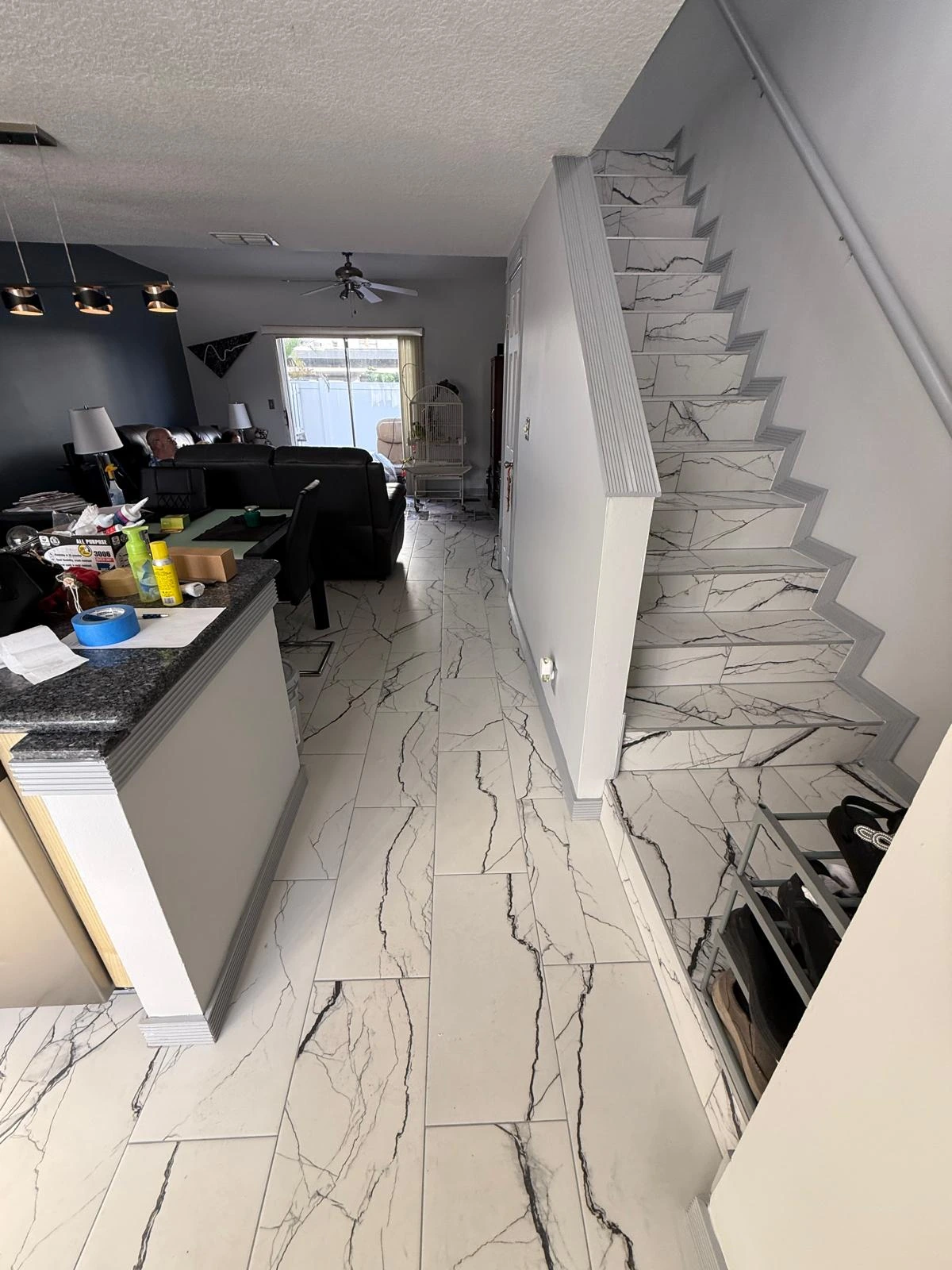 Marble-look porcelain flooring continuing up the staircase — Davie, FL